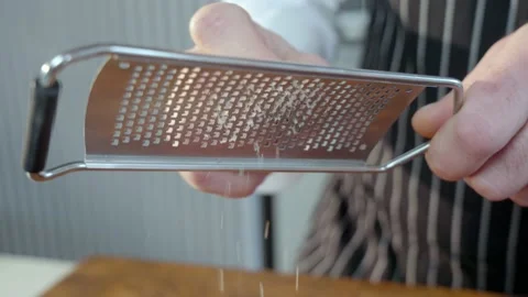 Grating pecans. A pile of pecans Slow motion video. The spices fall slowly. Stock Footage 235224178