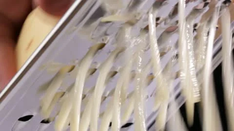 Grating a potato 스톡 동영상 22260199