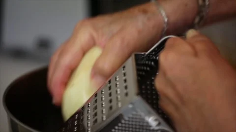 Grating a Potato Stock Footage 75212222