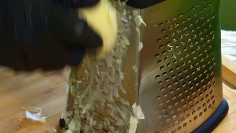 Grating Potatoes for Hash Browns Preparation Stock Footage 311391073