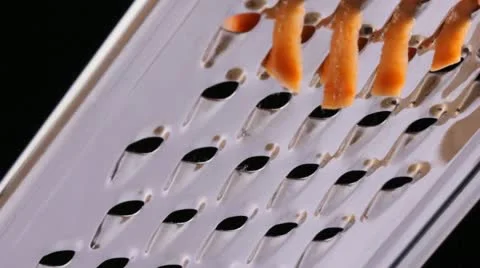 Grating a sweet potato Video stock 22260596