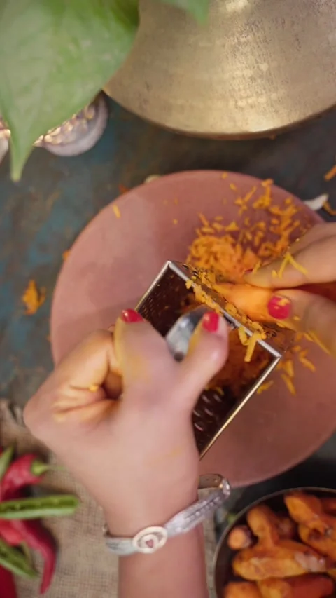 Grating turmeric or haldi, top angle shot of grating turmeric or haldi. Stock-Footage 283362984