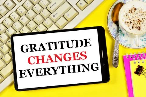 Gratitude changes everything. Text message on the smartphone screen. Stock Photos