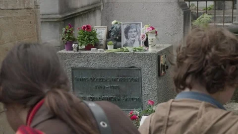 Grave of Rock legend Jim Morrison at Pere Lachaise cemetery in Paris Stock Footage 245454579