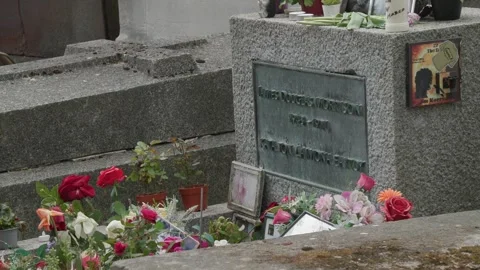 Grave of Rock legend Jim Morrison at Pere Lachaise cemetery in Paris Stock Footage 245454810