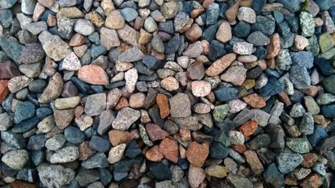 Gravel pattern of colored stones. Abstract nature pebbles background. Stone Stock Photos