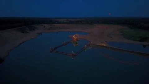 Gravel pit mining facility at dusk with orbital movement Stock Footage 340919842