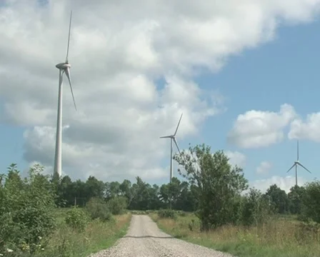 Gravel road windmill spin Stock Footage