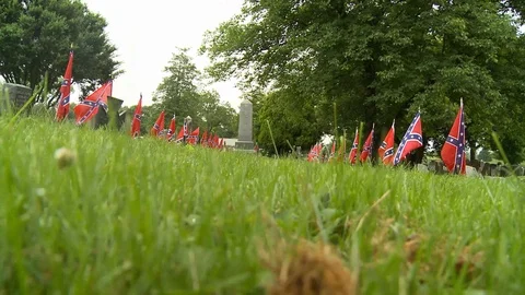 Graves row of Confederate flags Stock Footage 90499447