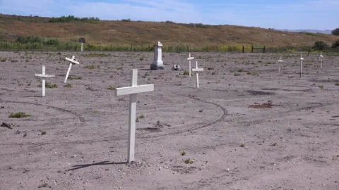 The graves of unknown Mexican immigrant Hispanic farm workers are marked by Video stock 141843593