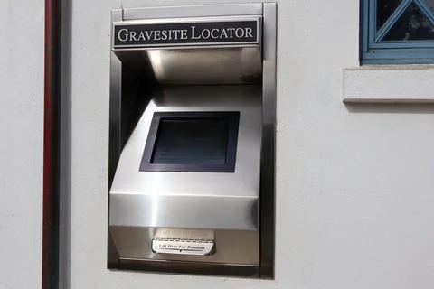 Gravesite locator computer and printer located in the entrance of Cemetery Stock Photos