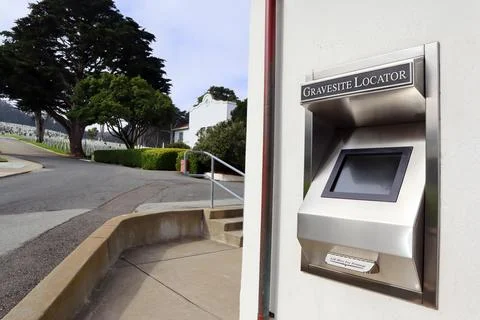 Gravesite locator computer and printer located in the entrance of Cemetery Stock Photos