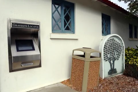 Gravesite locator computer and printer located in the entrance of Cemetery Stock Photos