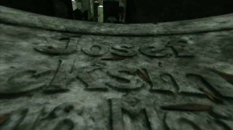 Graveslide moving camera over relief of headstone Stock-Footage 326741