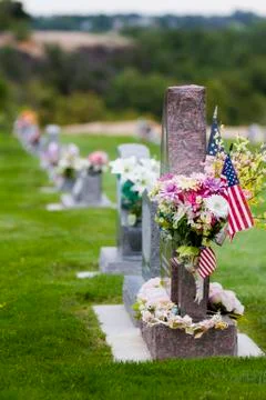Gravestone with american flags Stock Photos
