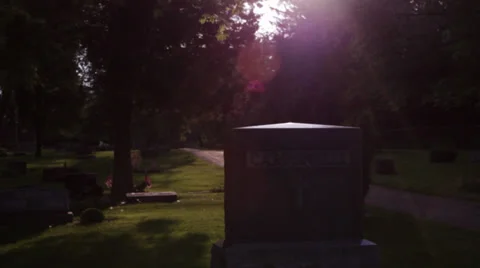 Gravestone pull in symbolic lighting Stock Footage 27479126