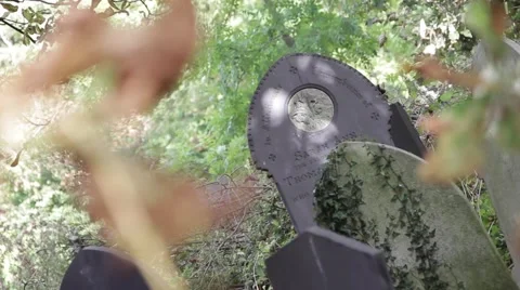 Gravestones &amp; Leaves Pull Focus in Old Church Yard 스톡 동영상 42508919