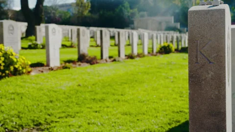 Gravestones in a row in a cemetery Stock Footage 274692778