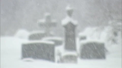 Gravestones in snowstorm in soft focus Stock Footage 47677450
