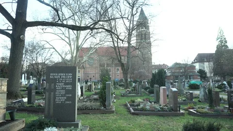 Graveyard with chruch in the background and mystic tree Video stock 100305794