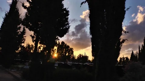 Graveyard,  clouds ,silouette trees, driving at Cemetery Stock Footage 119685037