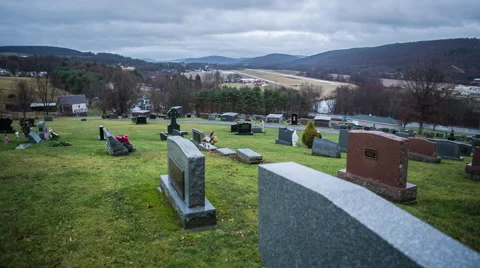 A graveyard on a cloudy, rainy day Stock Footage 58443277