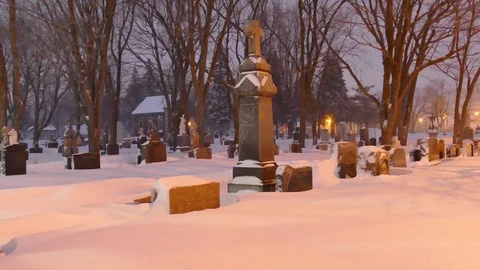 Graveyard during snowfall Stock Footage 103870597