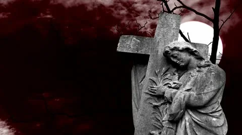 Graveyard statue set against timelapse bare tree and full moon Stock Footage 10610190