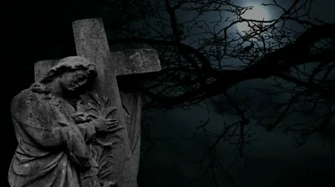 Graveyard statue set against timelapse bare tree and full moon Stock Footage