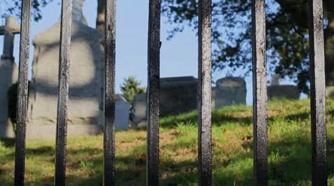 Graveyard through fence Stock Footage 8850676