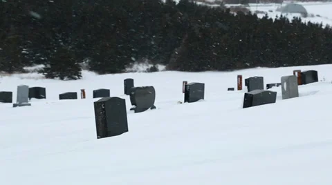 A graveyard in the winter storm panning shot Stock Footage 33899161