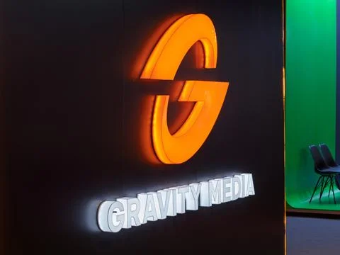 Gravity Media Logo Display on Modern Exhibition Stand Stock Photos