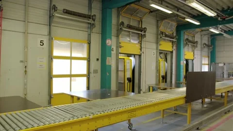 Gravity steel rollers for the easy movement and shifting of cargo boxes in Stock Footage 212300985