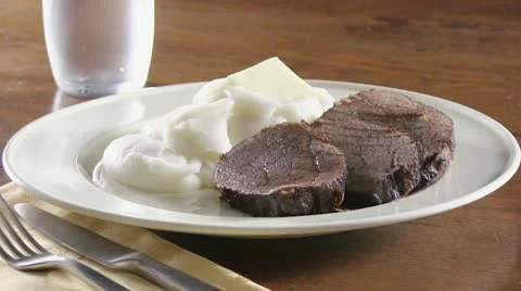 Gravy being poured over pot roast 스톡 동영상 24669540