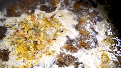 Gravy is boiling. the spatula is stirred by boiling gravy with meat. Stock Footage 201666196