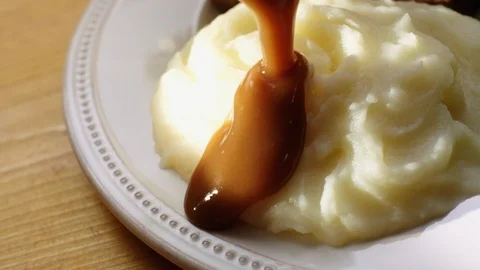 Gravy Pouring over Mashed Potatoes  Stock Footage 123184947