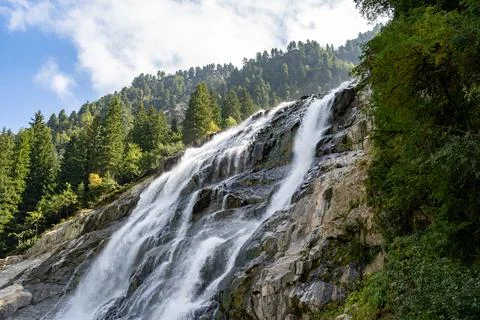Grawa Waterfall Cascading Down a Steep Rocky Cliff Face in Austria Stock Photos