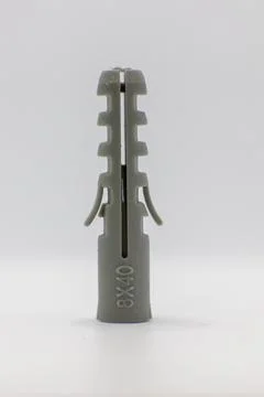 A gray 8x40 wall plug is shown against a white background. This is a common h Stock Photos