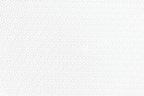 Gray abstract background of a macro shot of diamond pattern textured glass... Stock Photos