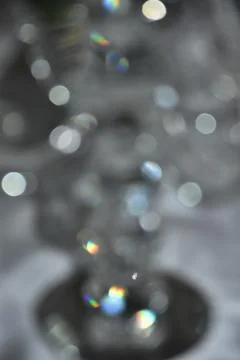 Gray abstract background with white and colored bokeh Stock Photos