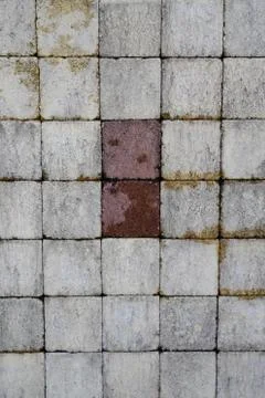 Gray abstract pattern background of grey red cobblestone pavement in close-up Stock Photos