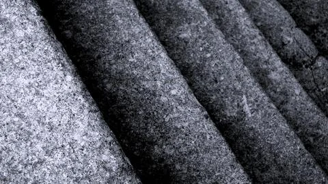 Gray abstract rough stone background. The texture of the stone wall. Close-up. Stock-Fotos