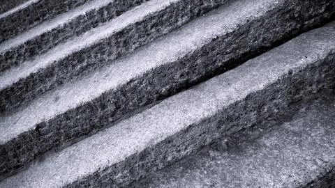 Gray abstract rough stone background. The texture of the stone wall. Close-up. Stock Photos