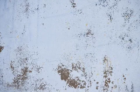 Gray, aged metal surface with rust spots and specks. Stock Photos