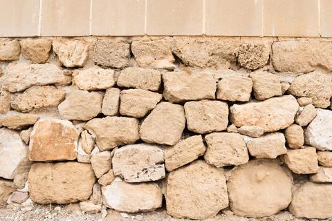 Gray and beige stone wall background Stock Photos