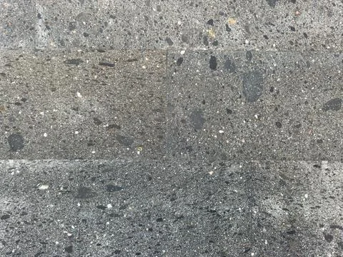 A gray and black tile wall with a black and gray stone pattern Stock Photos