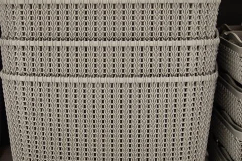 Gray and brown baskets on a shelf. Stock Photos