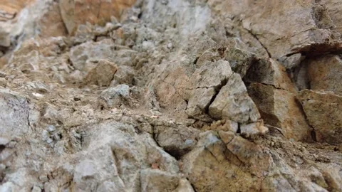 Gray and light brown crushed rocks, 4k Stockbeeldmateriaal 165926253