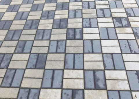 A gray and white brick patterned floor 写真素材