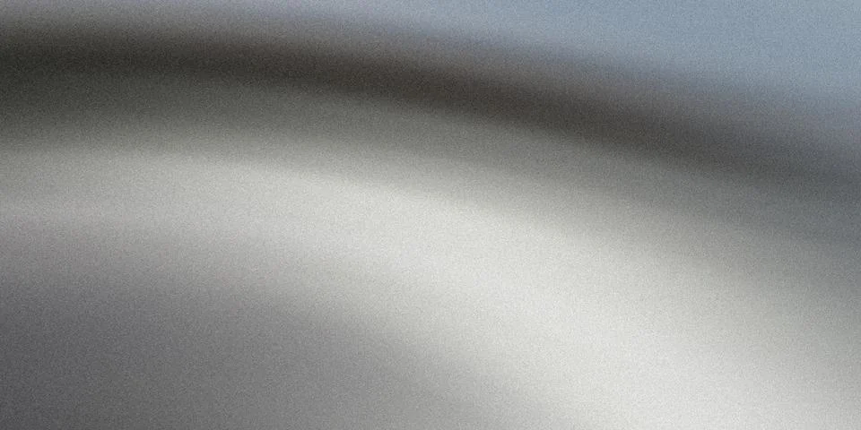 A gray and white gradient background with a textured surface Foto stock